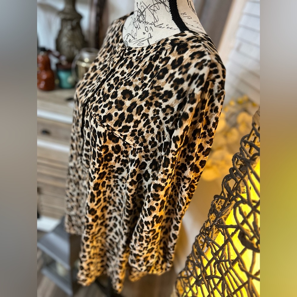 Cheeta print blouse.
